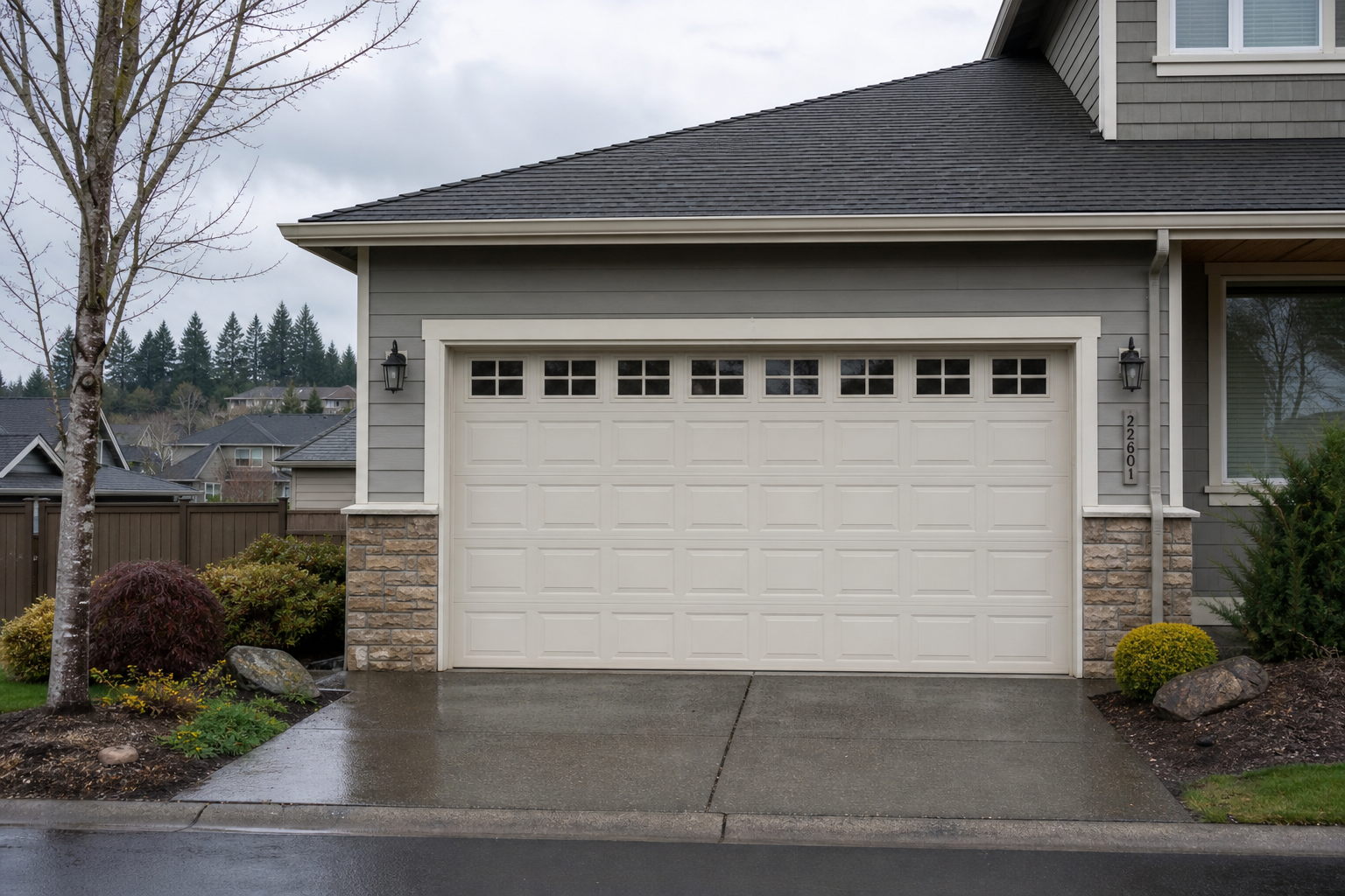 Suburban Issaquah home with a visible garage door on a cloudy day